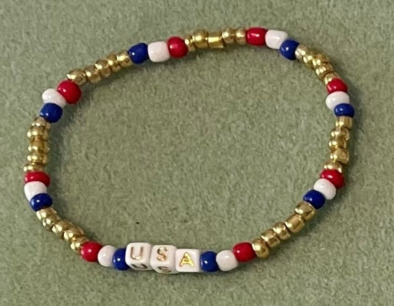 Hand-Crafted Beaded Stretch Bracelet: Word Gold "USA"